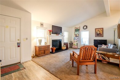 Living room featuring light wood-type flooring, lo