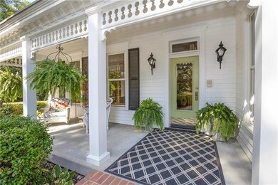 Relax on this charming front porch and notice the detail of the structure