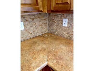 Kitchen. Stone backsplash with upgraded cabinets