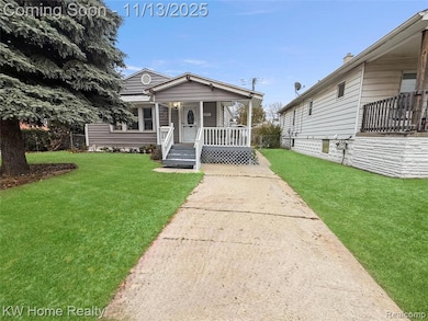 View of front of property featuring a front yard and a porch