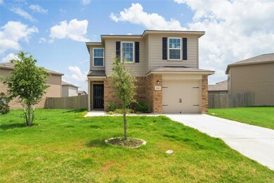 Traditional-style home with a front yard, concret