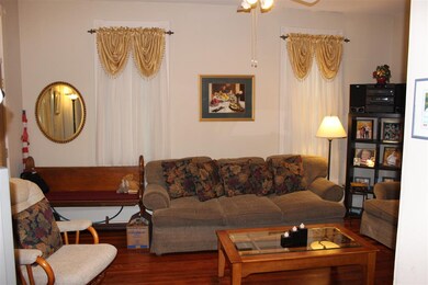 Our living room boasts original hardwood flooring 