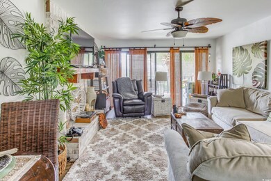 Living room with hardwood / wood-style flooring an