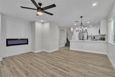 Unfurnished living room featuring a large fireplac
