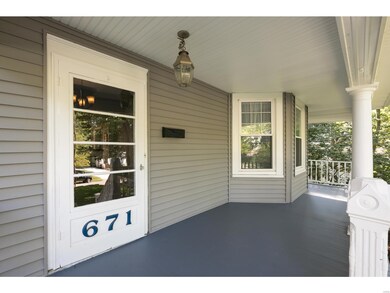 What an amazing covered front porch awaits you , just one of many architectural details in this century home.