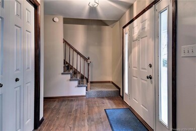 Foyer has hardwood floors.