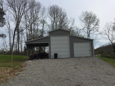 New 36x25 barn. Also has 2 pedestrian doors. Electric and water meters are already in place on property near the barn