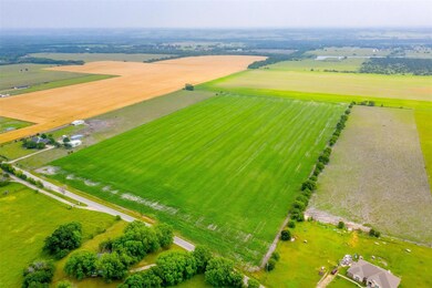 Birds eye view of property with a rural view