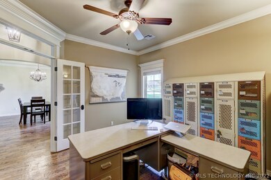 Study open to foyer via glass french doors