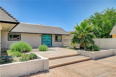 Entrance to property featuring stucco siding and a