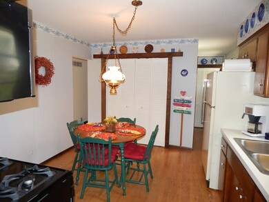 Table space in kitchen, hardwood floor, pantry and