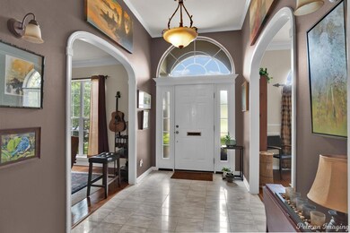 beautiful entry with marble leading into hardwood 