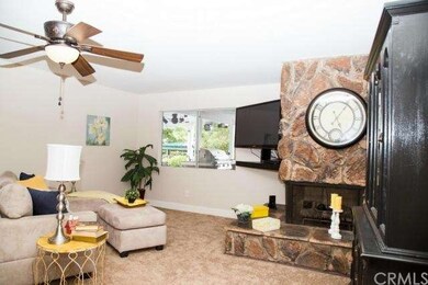family room with stone fire place