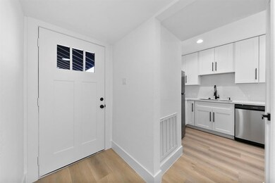 This photo showcases a bright entryway leading int