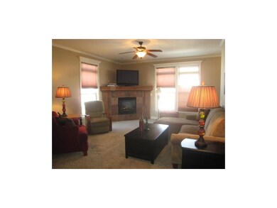 Relax in the inviting great room with gas log fire