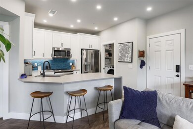 Kitchen with stainless steel appliances, washer /