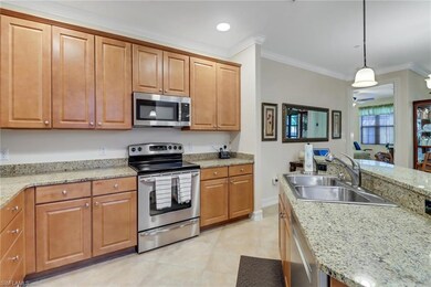 Kitchen with hanging light fixtures, stainless ste