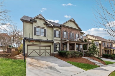 View of front of home featuring covered porch, con