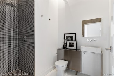 Full bathroom with a shower stall and vanity