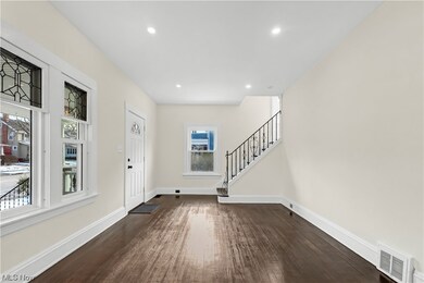 Entrance foyer featuring dark hardwood / wood-style flooring