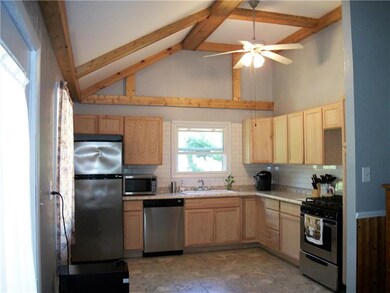 Cathedral ceilings with pine wood beams surround t