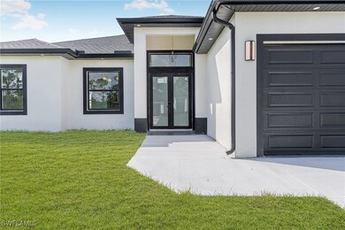 Entrance to property featuring french doors, roof