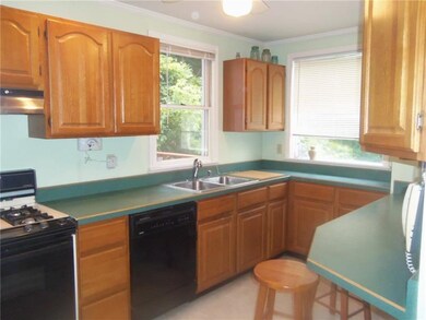 The kitchen offer plenty of cabinets. Refrigerator