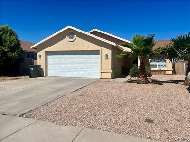 Ranch-style house featuring a garage