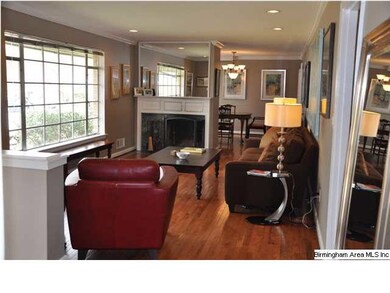 Living room with fireplace and crown molding!