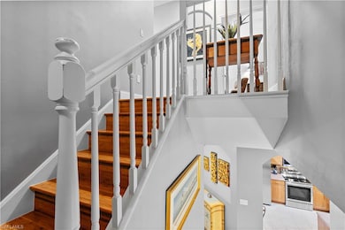 Staircase featuring a high ceiling