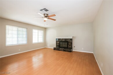 Unfurnished living room featuring visible vents, b