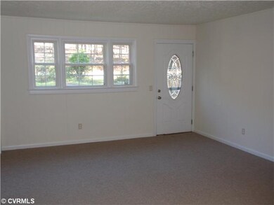 Exterior Front - Living room with all new carpet a