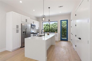 Large picture window opens to rear porch-great for