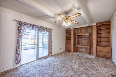 The den, looking out into the gorgeous sunroom