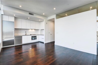 Kitchen with dark wood-style flooring, modern cab