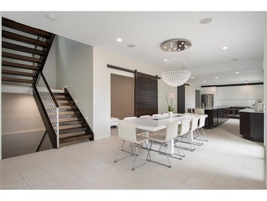 Floating stairwell leads to bedroom level and full