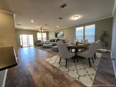 Dining area featuring baseboards, visible vents, 