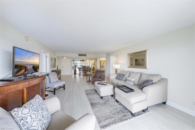 Living area with light wood-style floors and baseboards