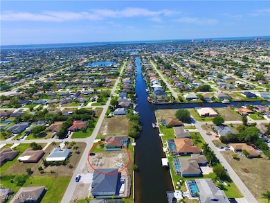 Aerial view featuring a water view and a residenti