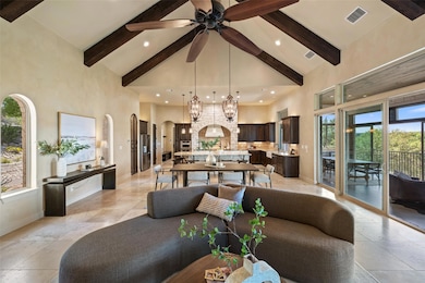 Living area featuring high vaulted ceiling, arche