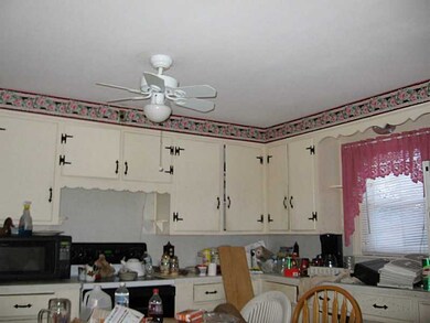 Kitchen. WOOD WHITE CABIINETS BUT SPACIOUS LAYOUT.