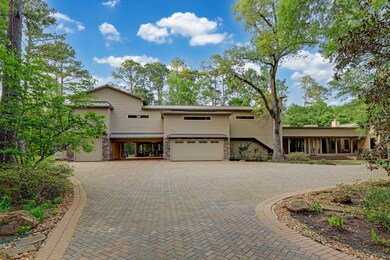 Arrive home via a private driveway that extends over a 5 acre easement (great for large gathering guest parking!) to an extended 2 car garage, 2 car porte cochere, RV garage, & guest parking.