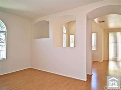 View of living room with opening to the family roo