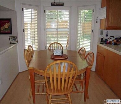 The breakfast nook features a laminate floor, ceil