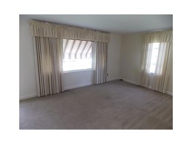 Living Room. Hardwoods under living room carpeting