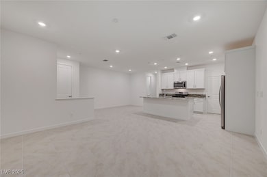 Kitchen featuring appliances with stainless steel