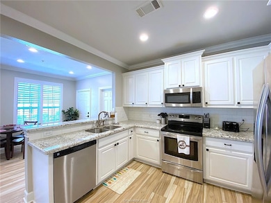 Kitchen with appliances with stainless steel finis