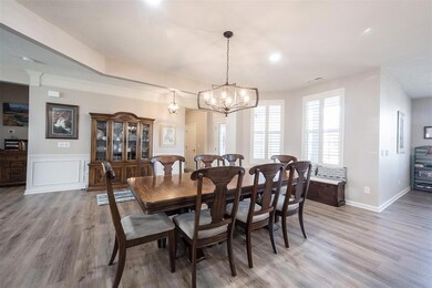 View of Dining Room from Kitchen - Bulkhead and Can Lighting