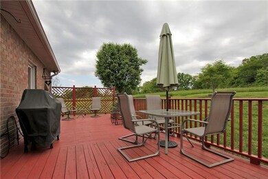A wide deck on the back of the house allows you to sit and enjoy the privacy of this property.