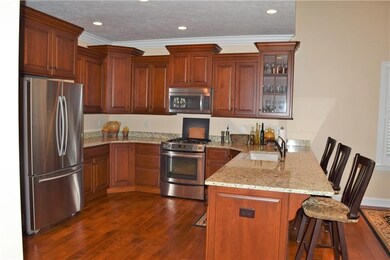 Custom kitchen cabinets with granite counter tops and stainless steel appliances